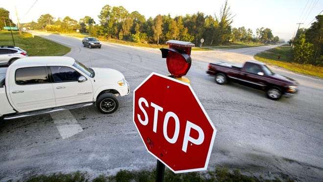 The intersection of Northlake and Hall Boulevards in The Acreage sees more than 10,000 vehicles a day. PBC traffic data indicates there have been 18 accidents — including 3 fatals — between 2009 and 2013. Residents in the area are calling for some kind of upgrade to the intersection, such as a stop light. (Lannis Waters / The Palm Beach Post)