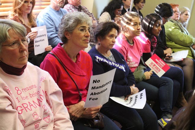 Every audience seat was taken at the House Judiciary Committee hearing on 12 abortion-related bills at the State House Tuesday afternoon and evening. Both sides of the issue were represented, with people carrying signs and T-shirts.