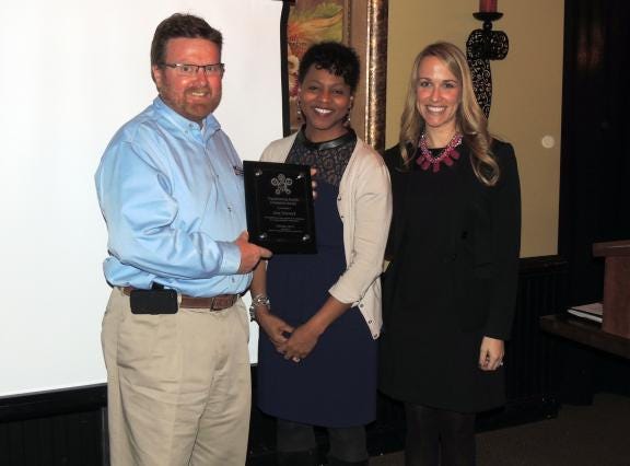 Greg Traywick receives the Transforming Health Champion Award on Feb. 18 in Cabarrus County. Pictured left to right: Greg Traywick, Cleveland County Extension Director; Tish Singletary, CTG State Project Consultant, NC Division of Public Health; and Erin Bayer, CTG Lead Regional Coordinator. (Special to The Star)