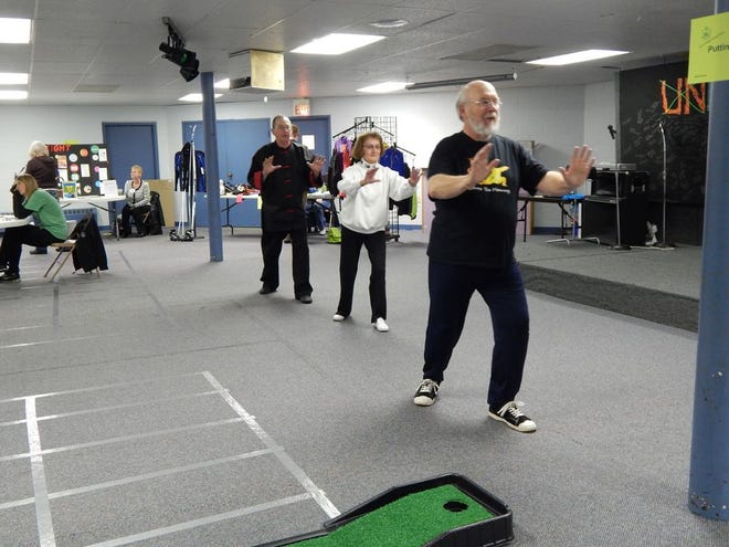 Peter MacDougall of Sault Ont., Bobbie Simon of Sault, Ont. and Paul Raappana of Sault Ste. Marie, Mich. demonstrated some Tai Chi moves as a relaxing way to exercise.