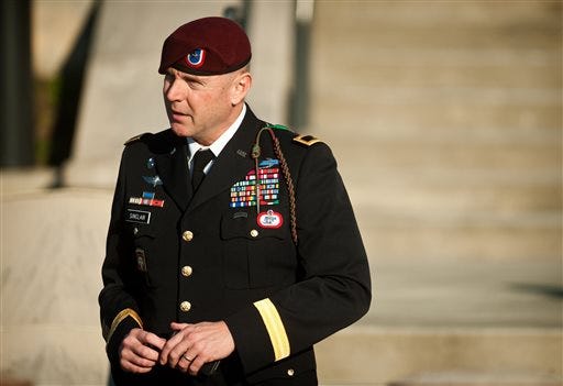 FILE - In this Tuesday, Jan. 22, 2013, file photo, Army Brig. Gen. Jeffrey A. Sinclair leaves a Fort Bragg, N.C., courthouse after he deferred entering a plea at his arraignment on charges of fraud, forcible sodomy, coercion and inappropriate relationships. Sinclair, 51, faces a maximum sentence of life in prison at a court-martial scheduled to begin March 3. (AP Photo/The Fayetteville Observer, Andrew Craft, File)