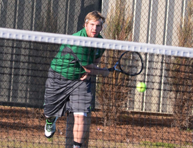 North Lenoir's Adam Williams chases down a ball in Tuesday's tennis match against Kinston High School at Bill Fay Park in Kinston.