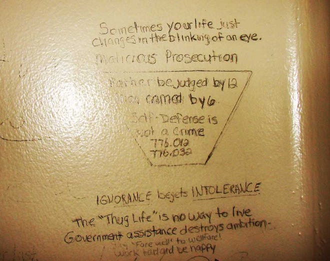 STATE ATTORNEYS OFFICE Some of the words scribbled on Michael Dunn's pre-trial jail cell include the state statute numbers for self-defense laws (bottom of triangle), the words "Thug Life" (bottom) and comments about how a life can change (top),