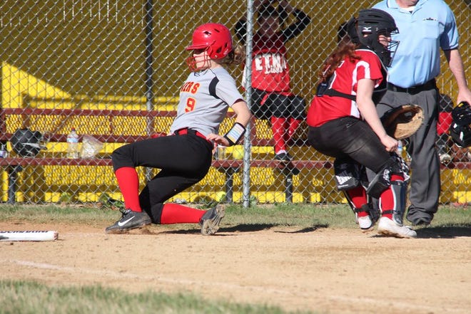 Jenna Toolanen of Yreka High slides into home as Etna catcher Sage Gomes waits for the ball to be thrown during Wednesday's game in Yreka. Daily News photo/Bill Choy