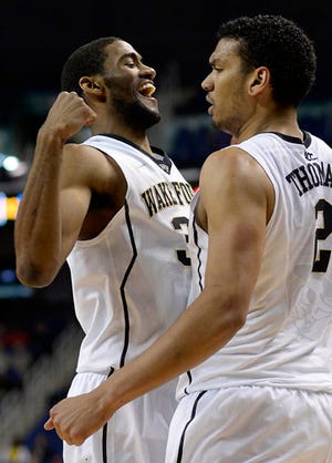 Wake Forest's Aaron Rountree and Devin Thomas celebrate during Wednesday's ACC Tournament game.
