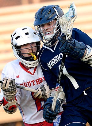 Western Alamance's Spencer Albright drives past Southern Alamance's Evan Melton during a boys' lacrosse game Tuesday night.