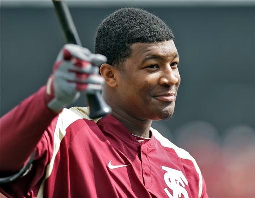 Florida State's Jameis Winston takes batting practice before a spring training exhibition game against the New York Yankees Tuesday, Feb. 25, 2014, in Tampa, Fla. Winston is the 2013 Heisman Trophy winner. (AP Photo/Chris O'Meara)