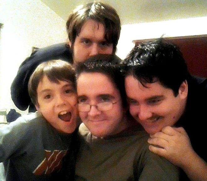 Daniel Favano (center) in a family photograph. He is with his brothers CJ ( right), Jimmy behind him and the youngest is Liam.