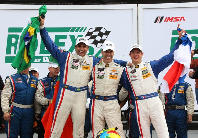 From left, Christian Fittipaldi, Joao Barbosa and Sebastien Bourdais celebrate in Victory Lane after winning the Rolex 24 at Daytona. The drivers are looking to score another win this weekend in Sebring.