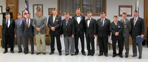 Past commanders of American Legion Post 284 are, from left, Hugh P. Cahill, Charles D. Pruitt Jr., C. David Pinelli Jr., Herbert G. Williams, William S. Feasenmyer Jr., Donald W. Dobrick, F.H. 'Tony' Morgan, Richard C. Oertel, Willie T. Harris, Jr., Charles E. Medeiros Sr. and Terry K. Brentlinger. Current Post 284 Commander John W. Ronkartz is at the far right.