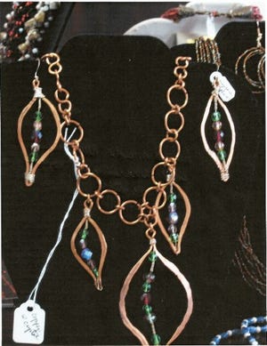 In addition to painting, Beth Hundley creates jewelry.