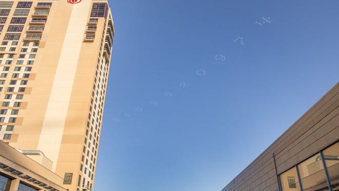 Five pilots wrote digits of pi over downtown Thursday, March 13, 2014. AUSTIN HUMPHREYS / AMERICAN-STATESMAN