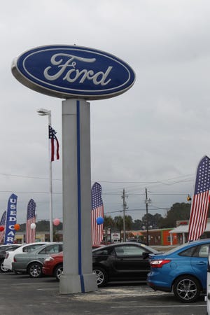 Sanders Ford is one of several businesses whose sign rises above Swansboro's 20-foot height limit for free-standing sign; under the regulations adopted in 2005, the owners of non-conforming signs have until March 15, 2015, to remove or bring the signs into compliance.