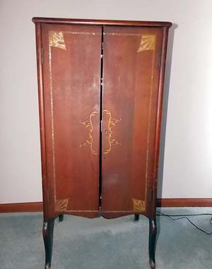 This music cabinet is just now becoming “antique,” but how does its condition affect its value?