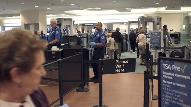 TSA agents man the new Precheck line for boarding passengers.