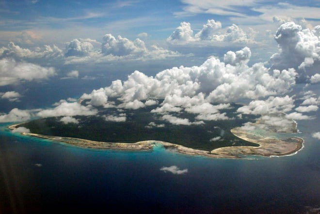 In this Nov. 14, 2005 file photo, clouds hang over the North Sentinel Island, in India's southeastern Andaman and Nicobar Islands.