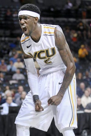 AP PHOTO
VCU guard Briante Weber reacts after scoring during a game against Richmond in the quarterfinal round of the Atlantic 10 Conference tournament in New York on Friday night.
