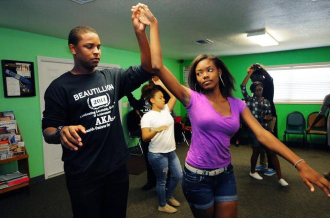 Jazmin Styles and Tyler Randall practice the waltz with other couples March 8 at the Kelly Brown Career Center in Palmetto.