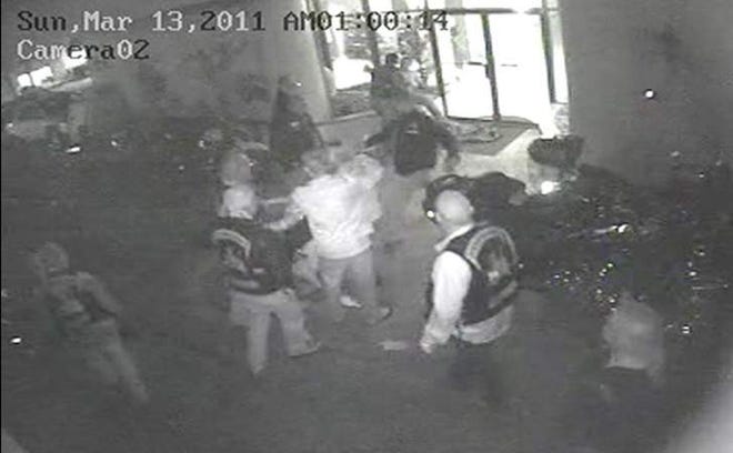 This still shot of the fight taken from surveillance footage at the Pirates Cove in Daytona Beach Shores. An Enforcers Motorcycle Club member is set for trial next month on aggravated battery charges for throwing a man to the ground and kicking him in the face during a confrontation during Bike Week 2011.