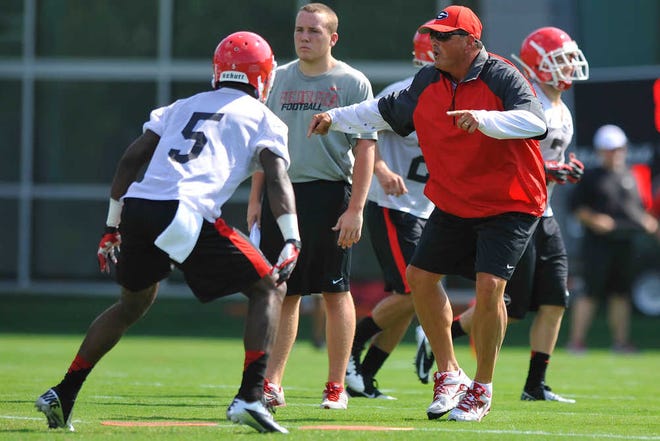 Todd Grantham shouts instructions as Damian Swann runs a drill on the field during the first day of the University of Georgia football practice in Athens, Ga., August 1, 2013. (AJ Reynolds/Staff, @ajreynoldsphoto)
