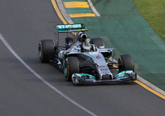 Mercedes driver Nico Rosberg of Germany controls his car on turn two during the Australian Formula One Grand Prix at Albert Park in Melbourne, Australia, Sunday, March 16, 2014. Rosberg comfortably won the race, after pole sitter and teammate Lewis Hamilton plus world champion Sebastian Vettel suffered early retirements. (AP Photo/Rob Griffith)