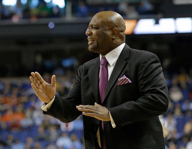 Florida State head coach Leonard Hamilton directs his team against Florida State during the first half of a quarterfinal NCAA college basketball game at the Atlantic Coast Conference tournament in Greensboro, N.C., Friday, March 14, 2014. (AP Photo/Gerry Broome)