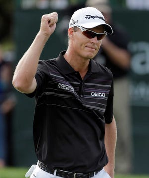 John Senden, of Australia, celebrates after making a birdie putt on the 17th hole during the final round of the Valspar Championship golf tournament at Innisbrook, Sunday, March 16, 2014, in Palm Harbor, Fla. Senden went on to win the tournament. (AP Photo/Chris O'Meara)