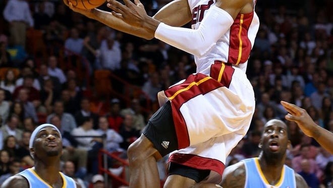 MIAMI, FL - MARCH 14: Ray Allen #34 of the Miami Heat drives to the basket during a game against the Denver Nuggets at American Airlines Arena on March 14, 2014 in Miami, Florida. NOTE TO USER: User expressly acknowledges and agrees that, by downloading and/or using this photograph, user is consenting to the terms and conditions of the Getty Images License Agreement. Mandatory copyright notice: (Photo by Mike Ehrmann/Getty Images)