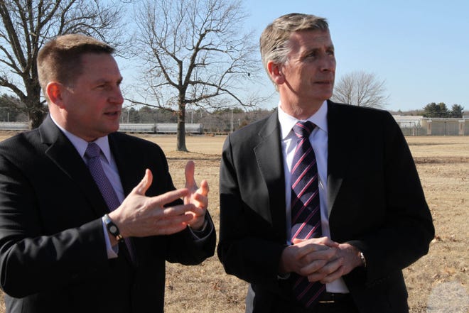 Steven J. King, left, managing director, Quonset Development Corporation, and Liam McClennon, CEO of Greencore USA, look over the site where Greencore will build its new facility.
