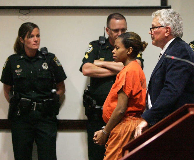 Ebony Wilkerson enters the courtroom with attorney Craig Dyer, for a bail hearing on, Monday March 17, 2014 at the Justice Center in Daytona Beach, Fla. Judge Leah Case said at Monday's hearing that she will postpone making any decision about Ebony Wilkerson until listening to more testimony next week. Wilkerson is charged with attempted murder for driving her three children into the ocean off Daytona Beach. (AP Photo/The Daytona Beach News-Journal, David Tucker)