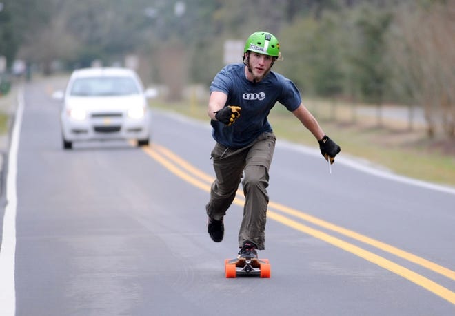 Drew Lewis makes a test run of the first leg of his 9,000 mile skateboard voyage around America, which will begin Wednesday in Wilmington.