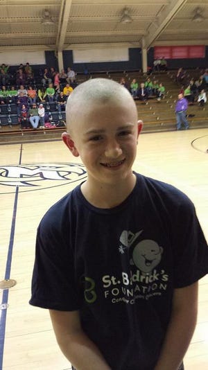 Gavin King after getting his head shaved