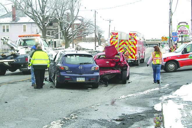 Emergency personnel inspect the scene of a three-vehicle accident on East Baltimore Street near exit 5. They were called at approximately 2:15 p.m. Rescue Hose Company No. 1 and Greencastle police responded.
