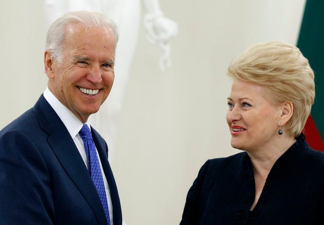 Vice President Joe Biden, left, and Lithuania's President Dalia Grybauskaite speak prior to their meeting at the Presidential Palace in Vilnius, Lithuania, Wednesday, March 19, 2014. Biden arrived in Vilnius for consultations with Grybauskaite and Latvia's President Andris Berzins, a few hours after Russian President Vladimir Putin approved a draft bill for the annexation of Crimea, one of a flurry of steps to formally take over the Black Sea peninsula. (AP Photo/Mindaugas Kulbis)