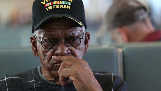 Army Sgt. 1st Class Melvin Morris waits at the JetBlue gate on his way to Washington, DC. (Joe Raedle/Getty Images)