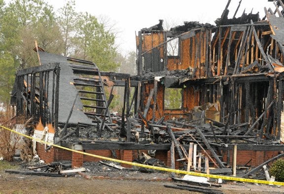 A family of six escaped an early-morning fire at this home on Pear Tree Lane in Dinwiddie County on Tuesday.