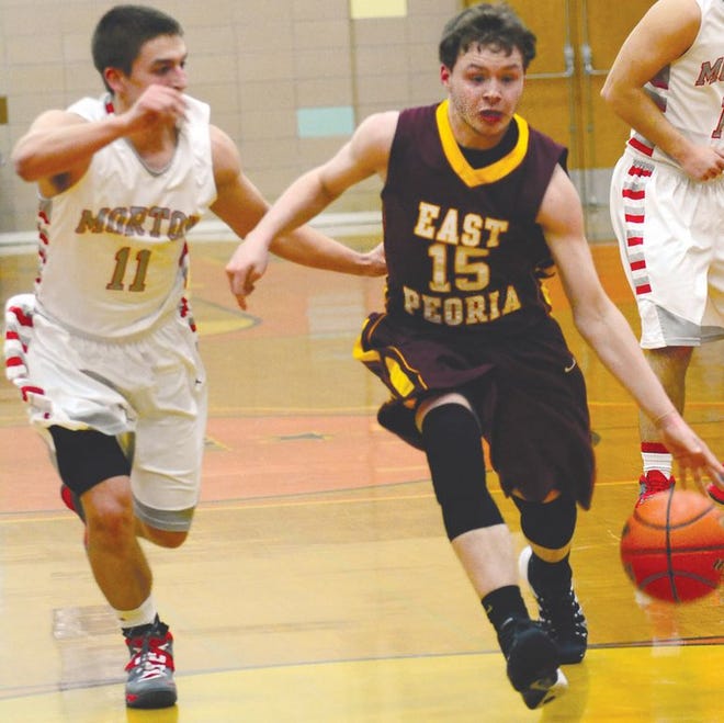 East Peoria senior guard Benett Crim, right, led the boys basketball team with 54 assists to go along with 5.6 points and 4.1 rebounds per game. The Raiders added three wins to their ledger this season to finish 5-22 in 2013-14.