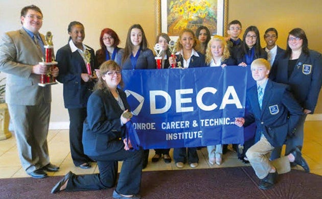 From MCTI at the DECA competition standing from left are Thomas Kelly, Alycia Gatling, Kristina Pomichowski, Meaghan Doerbecker, Edilia Matias, Anthony Ciuppa and Keziah Duncan, In middle from left are Samantha Soto, Rebecca Cruz, Katrina Fader, Giselle Mosquera and Marialena Wieber. Kneeling in front are Abigail Ross, left, and Caleb Barnes. Missing from photo is Brianna Seminerio.