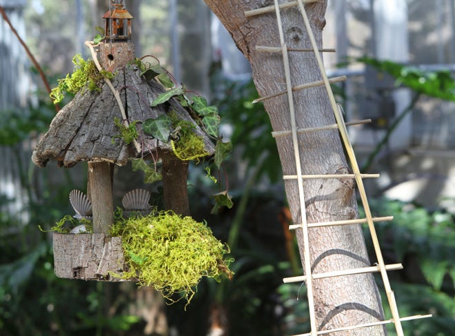 A fairy house at the Roger Williams Park Botanical Center, crafted with all-natural materials, uses scallop shells to make mini seating areas for wee folk.
