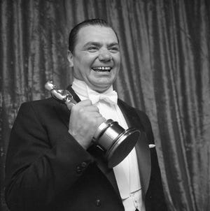 Ernest Borgnine holding his Oscar for Best Actor for his performance in "Marty" (1955).