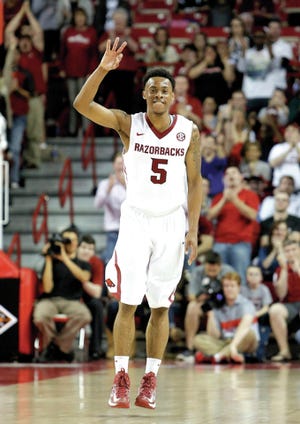 Photo by Marc F. Henning
Arkansas' Anthlon Bell celebrates after sinking a 3-point shot during the second half of the Razorbacks' 91-71 win Tuesday, March 18, 2014, over Indiana State in the first round of the NIT Tournament at Bud Walton Arena in Fayetteville, Ark. Bell scored a career-high, game-high 28 points against the Sycamores. 
 Photo by Marc F. Henning
Arkansas' Anthlon Bell celebrates after sinking a 3-point shot during the second half of the Razorbacks' 91-71 win Tuesday, March 18, 2014, over Indiana State in the first round of the NIT Tournament at Bud Walton Arena in Fayetteville, Ark. Bell scored a career-high, game-high 28 points against the Sycamores.