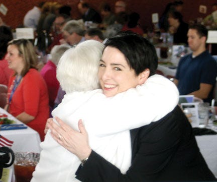 Denise Kiernan, author of ‘The Girls of Atomic City’ shares a hug with one of the ‘Girls,’ Dorothy Wilkinson at the Lunch-4-Literacy at Oak Ridge High School on Tuesday. The best-selling author was the guest speaker.