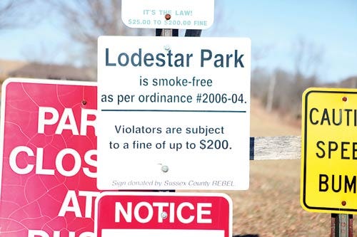 Photo by Marie Dirle/New Jersey Herald - Of all the signs adorning the entrance to Lodestar Park in Fredon, one ordering a smoke-free park is central.