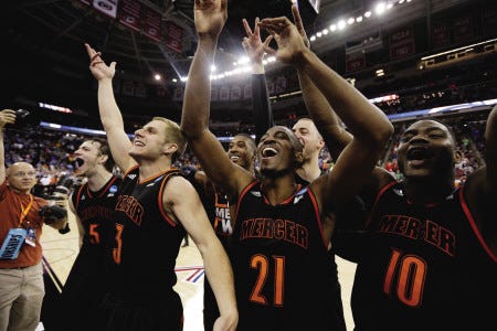 Mercer guard Langston Hall (21) and teammates celebrate after upsetting No. 3 Duke in a second round game of the NCAA men’s basketball tournament on Friday in Raleigh, N.C. No. 14 Mercer won 78-71.