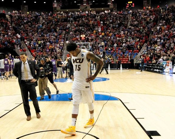VCU forward Juvonte Reddic walks off the court after losing to Stephen F. Austin in overtime in a second-round game in the NCAA tournament Friday night in San Diego.