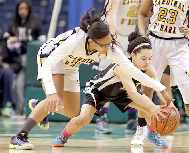 Cardinal O'Hara's Jailyn Dickson (left) and Martin Luther King Jr's Yamira Saez battle for a loose ball during the New York State Federation Tournament of Champions girls' Class A basketball final Sunday in Albany, N.Y.



AP Photo/Mike Groll