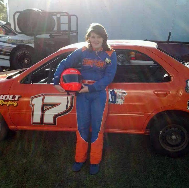 This family photo from Facebook shows Niokoa Johnson with her car. The 15-year-old girl died following a crash at Bubba Raceway Park on Saturday.