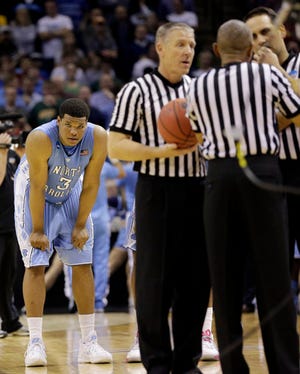 North Carolina forward Kennedy Meeks, left, waits as game officials determine time expired after Iowa State's last basket.