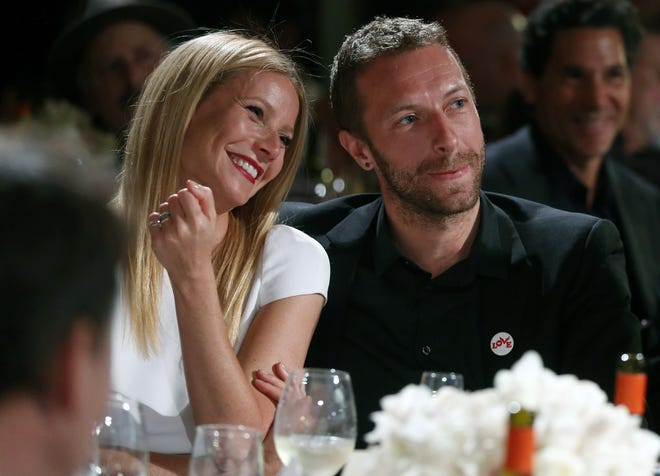 This Jan. 11, 2014 file photo shows actress Gwyneth Paltrow, left, and her husband, singer Chris Martin at the 3rd Annual Sean Penn & Friends Help Haiti Home Gala in Beverly Hills, Calif.
