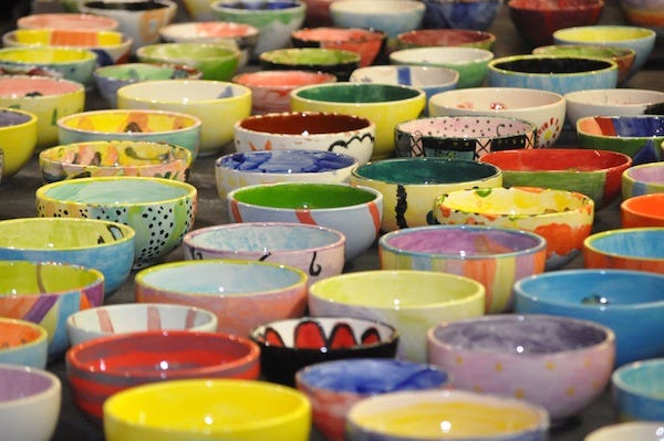 Some of the 1,200-plus bowls await diners for Thursday's Empty Bowls Project at the Brownwood Coliseum.